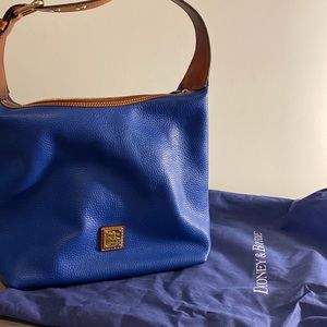 Dooney & Bourke pebble grain Paige sac with tassels.